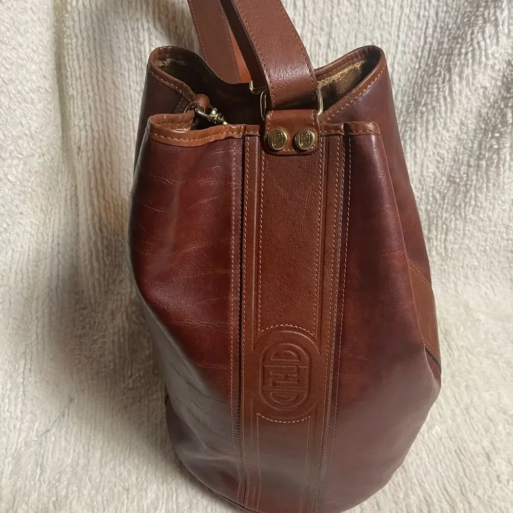 Fortune Duck vintage leather Brown sling back bucket style bag.